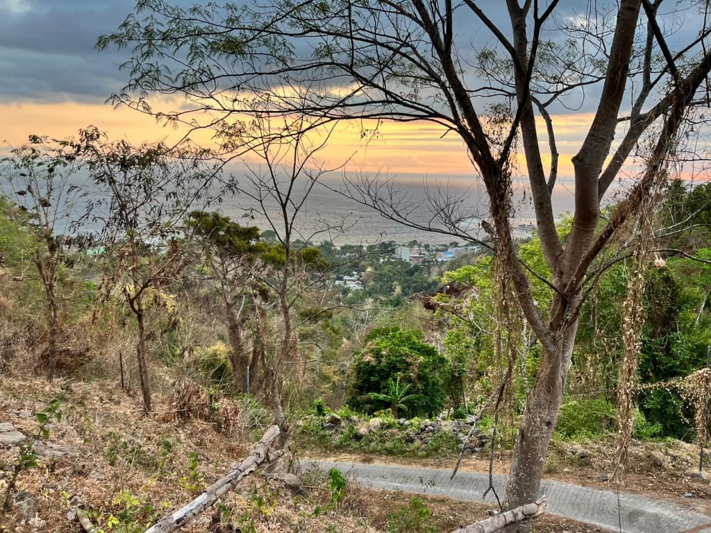 Sunset over Senggigi coastline view from Locco Hill land